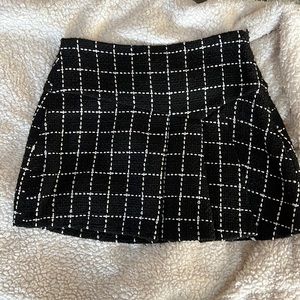 BCBG Generation black skirt with great white stitching detail.